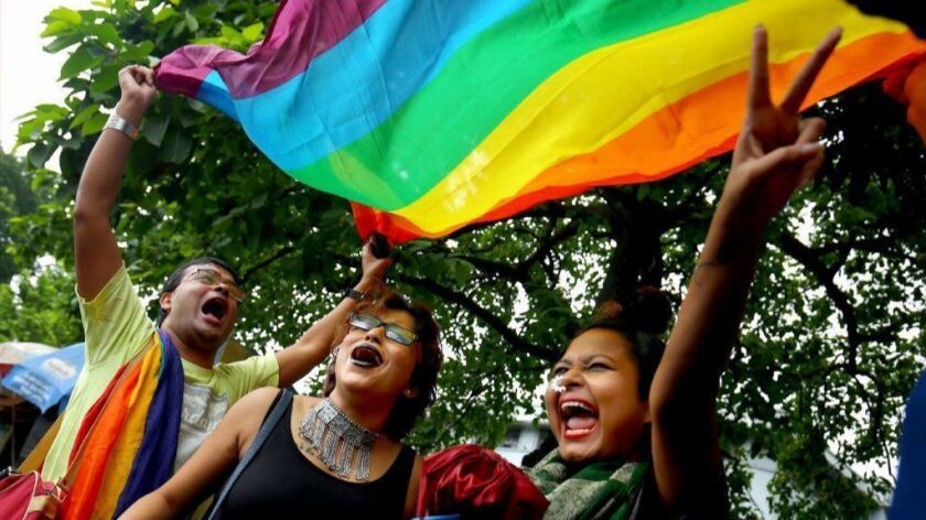 LGBTQ activists celebrate in Kolkata, India, after the Indian Supreme Court struck down a colonial-era law banning gay sex between consenting adults.