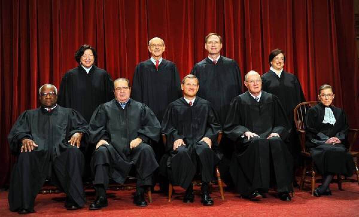 Supreme Court Chief Justice John G. Roberts Jr., center front, showed this year that he wasn't welded to the conservative majority.
