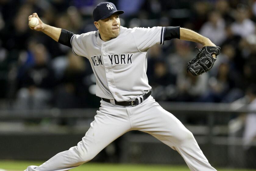 Yankees relief pitcher Alfredo Aceves works against the White Sox during a game earlier this season in Chicago.