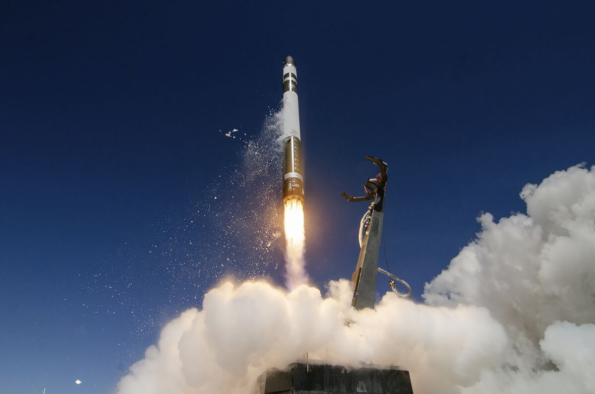 In this Oct. 17, 2019, photo supplied by Rocket Lab, an Electron rocket makes a successful launch from the Mahia Peninsula launch site on the North Island of New Zealand. New Zealand has become the latest country to sign a space agreement with U.S. space agency NASA, just as New Zealand's nascent space industry begins to take off. (Simon Moffatt/Rocket Lab via AP)