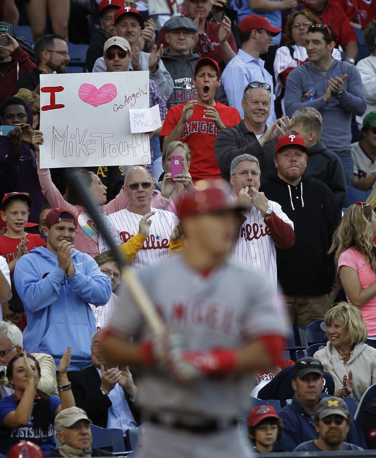 Fans cheer as Angels' Mike Trout approaches the plate for his first at-bat.
