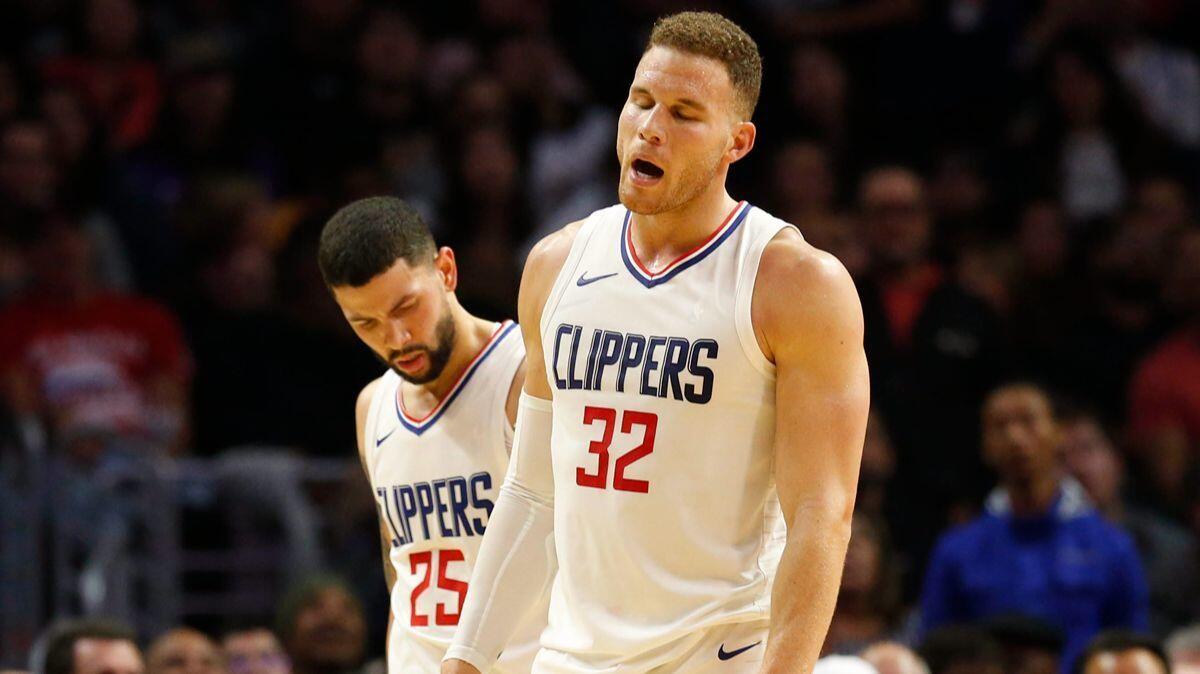 Clippers forward Blake Griffin (32) is injured late in the fourth quarter against the Lakers at Staples Center on Monday.