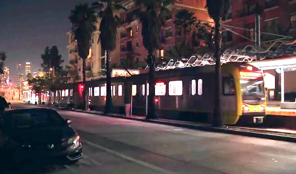 A city commuter train is shown at nighttime.