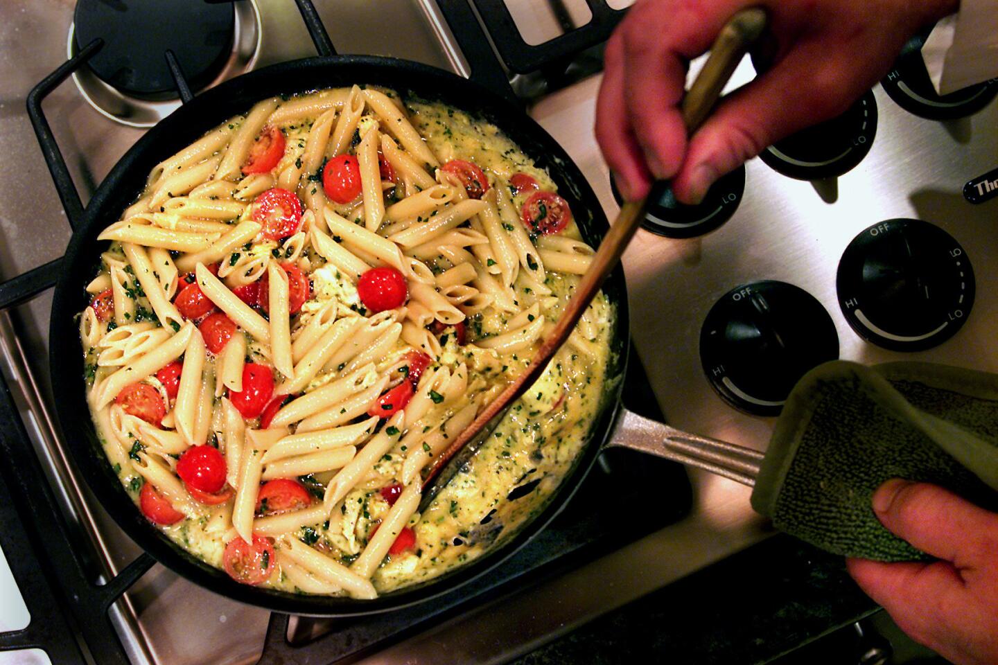 Pasta frittata with cherry tomatoes and fresh herbs