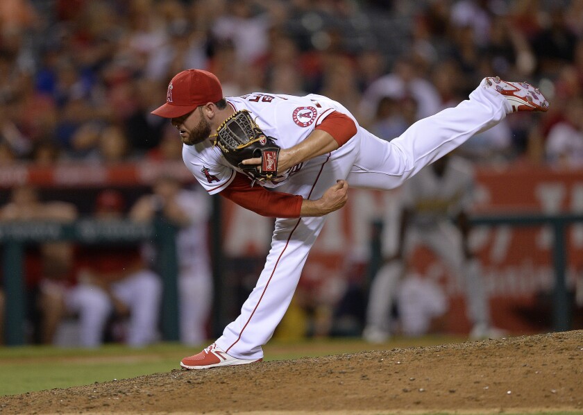 Angels reliever Cam Bedrosian (68) throws against the Oakland Athletics during the ninth inning on Aug. 2.