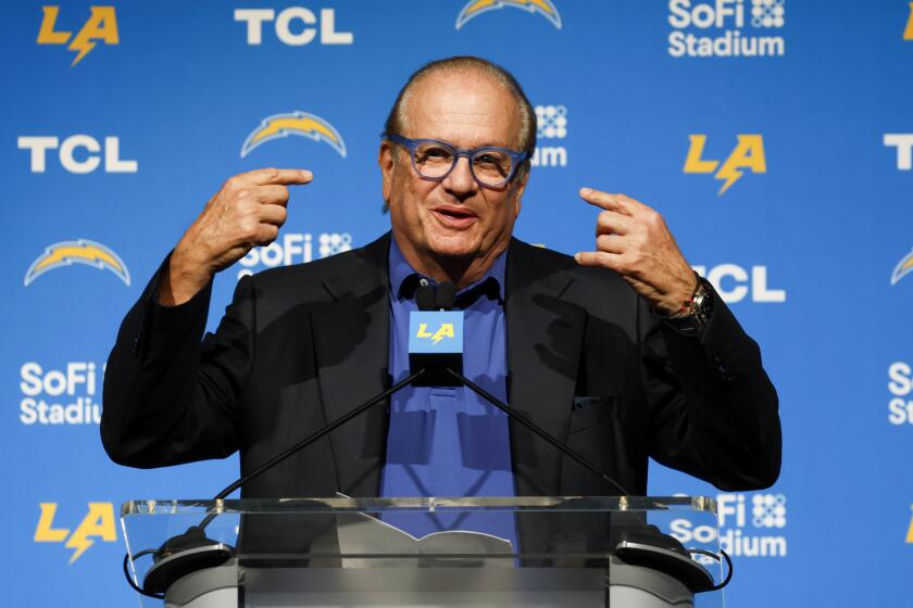 Chargers owner Dean Spanos makes opening remarks during the introductory press conference for Chargers coach Jim Harbaugh.
