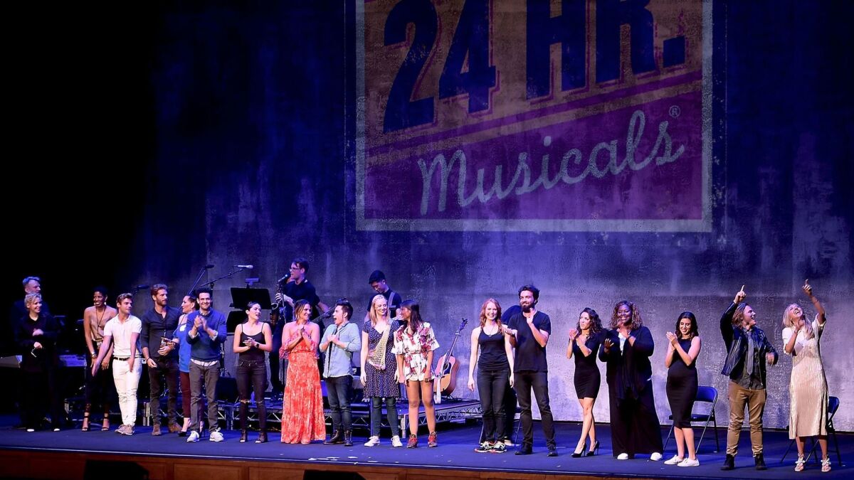 The cast of 24 Hour Musicals: Los Angeles laughs through the curtain call after an evening of wacky performances Monday night in L.A.