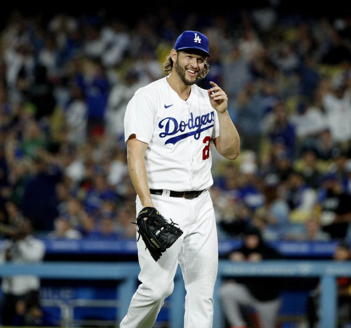 Dodgers pitcher Clayton Kershaw reacts after left fielder David Peralta makes a diving catch.