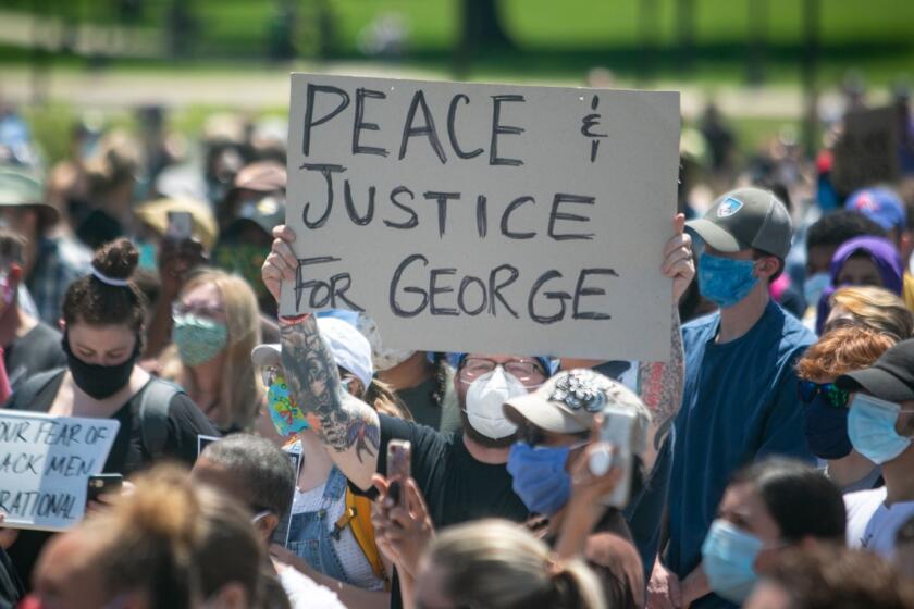 MINNEAPOLIS , MINNESOTA - MAY 31: Thousands of protesters gather at the Minnesota State Capitol on Sunday to demand justice for George Floyd as the Minnesota National Guard secured the perimeter of the capitol building on Sunday, May 31, 2020 in Minneapolis , Minnesota.