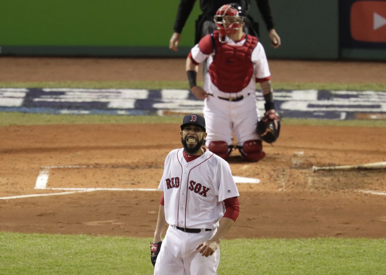Red Sox pitcher David Price grimaces as a run is scored on a Matt Kemp sacrifice fly to tie the game in the fourth inning.