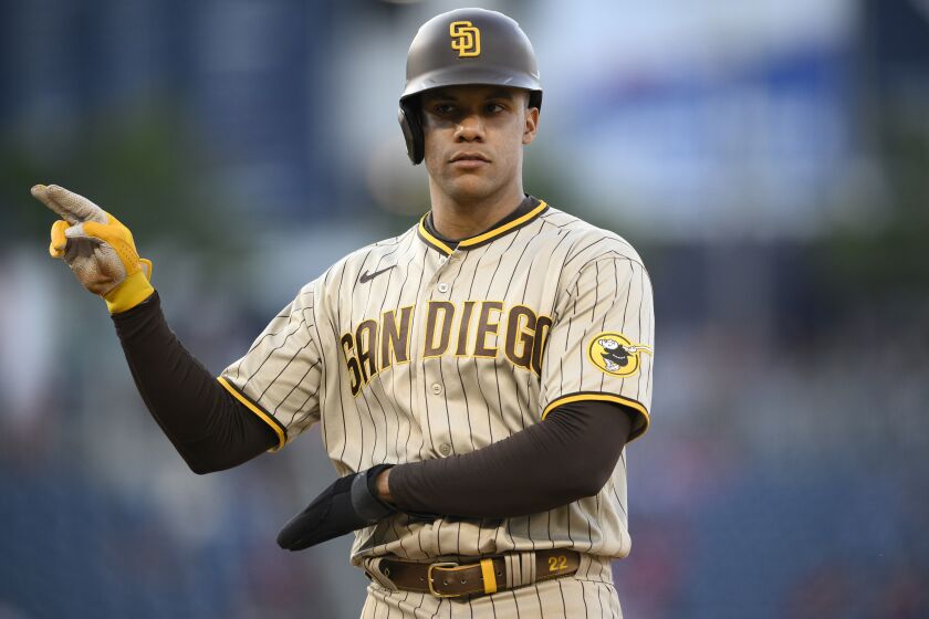 San Diego Padres' Juan Soto gestures at first base during the ninth inning of the team's baseball game against the Washington Nationals, Thursday, May 25, 2023, in Washington. The Padres won 8-6. (AP Photo/Nick Wass)