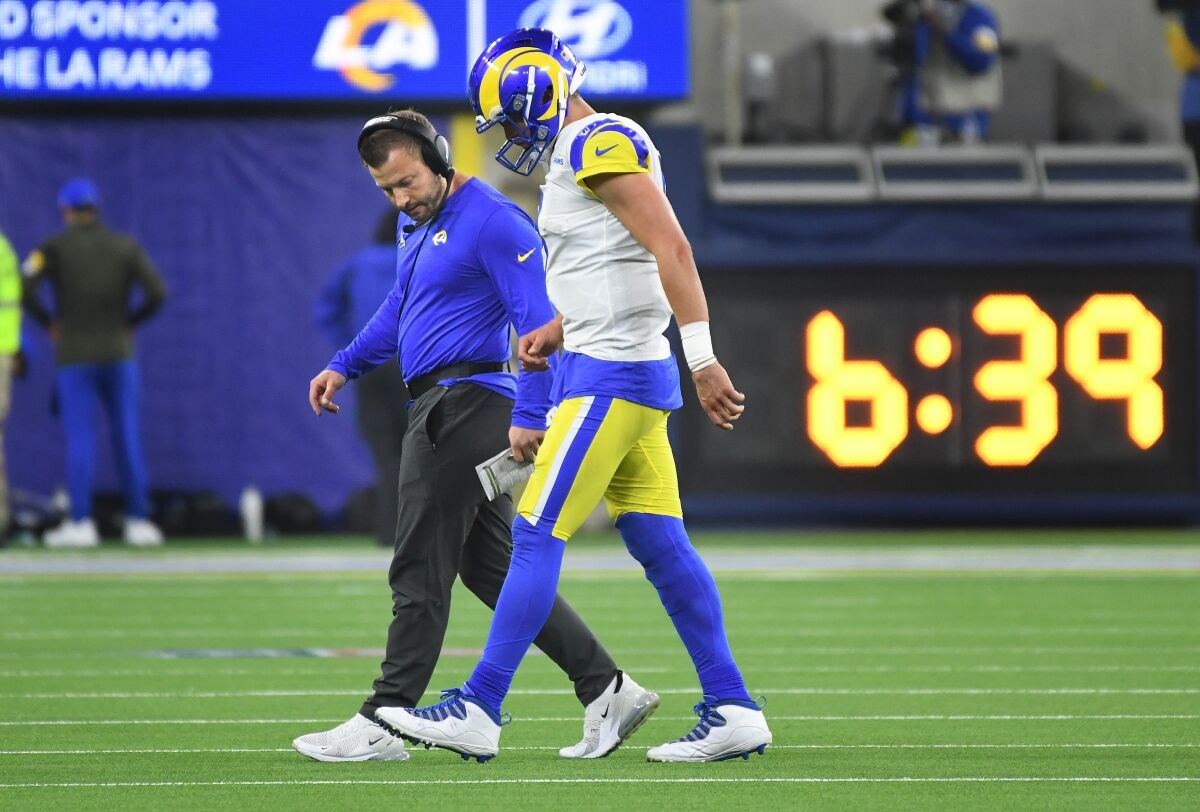  Rams head coach Sean McVay looks at the foot of quarterback Matthew Stafford, who was injured in the fourth quarter.