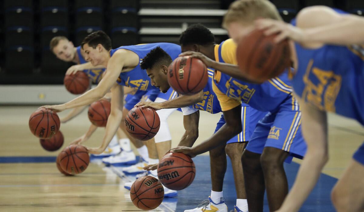 UCLA players run a drill during the team's media availability on Oct. 12.