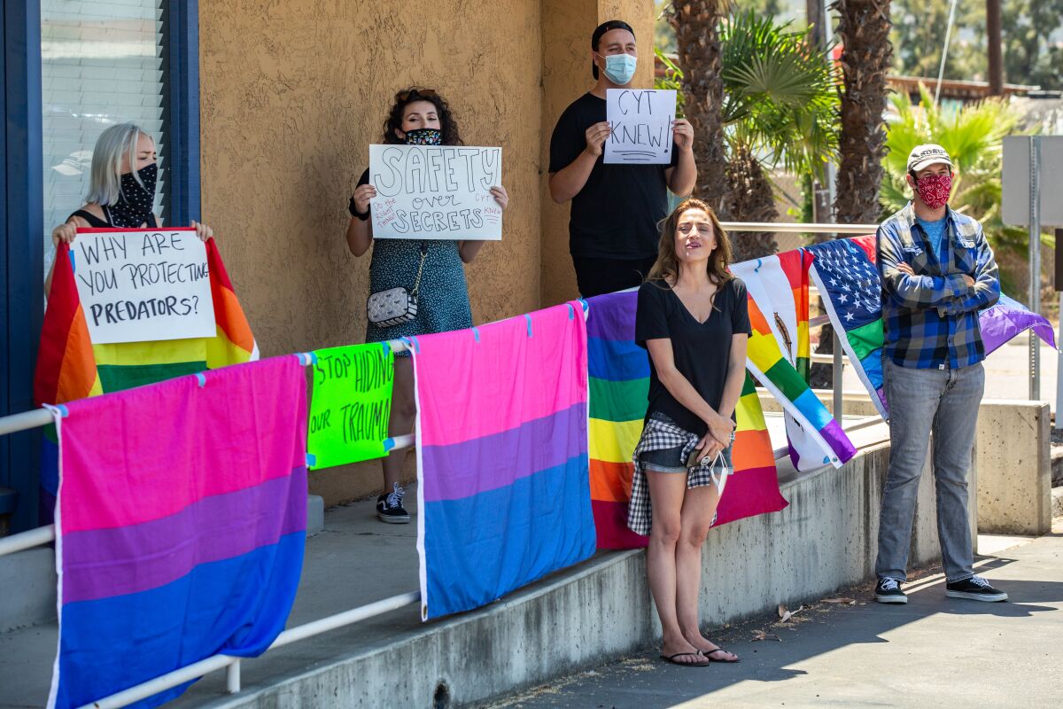 July 24, 2020, file photo, protestors gather outside El Cajon headquarters of Christian Youth Theater