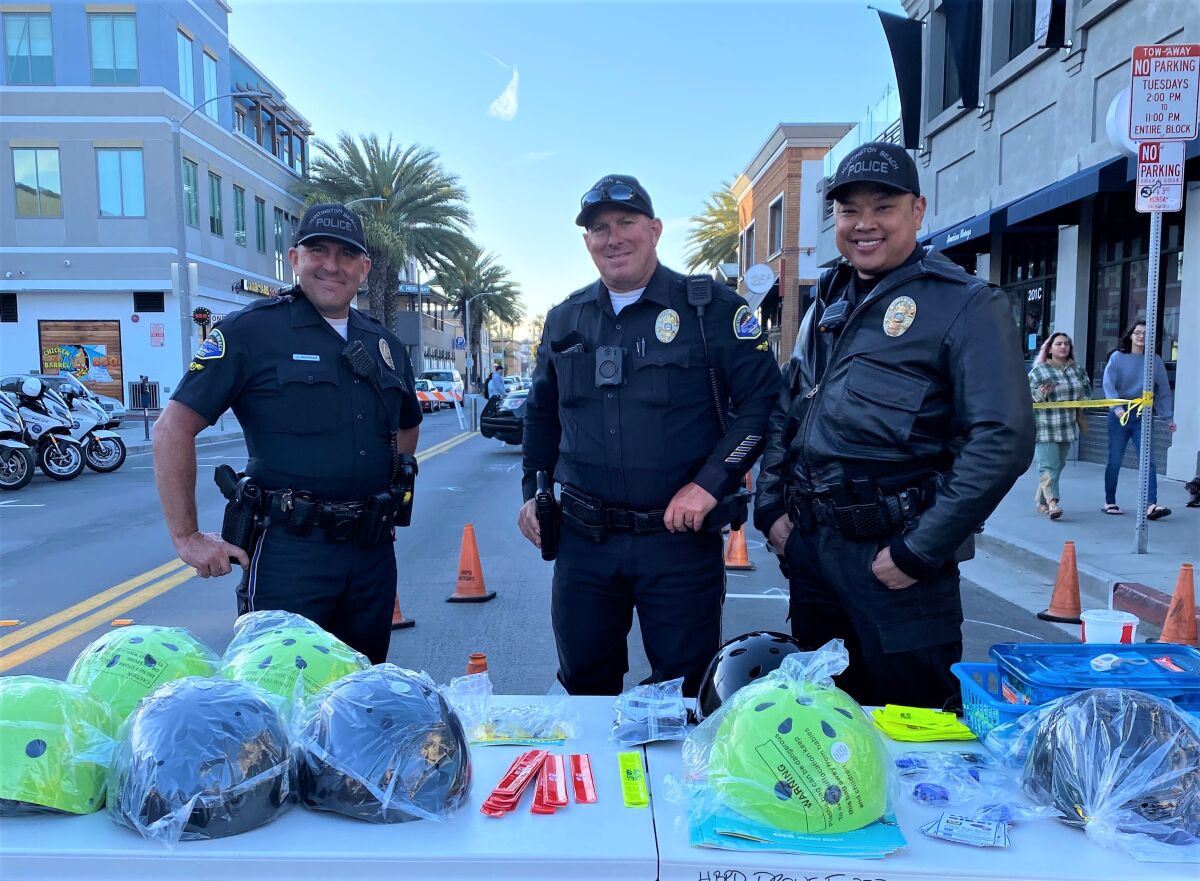 Huntington Beach officers at a Surf City Nights Tuesday encouraged people to register bikes at Project 529.