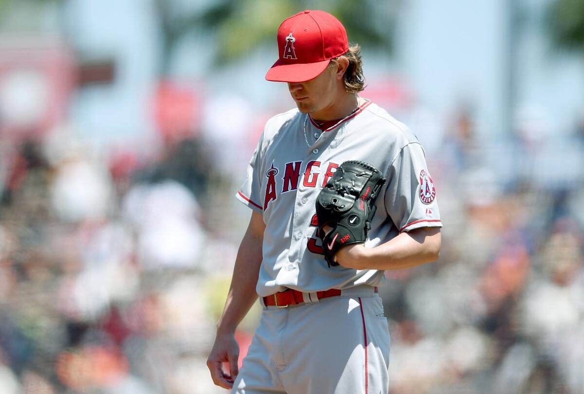 Angels pitcher Jered Weaver reacts after giving up a home run to Giants second baseman Joe Panik in the first inning of Sunday's game at AT&T Park.