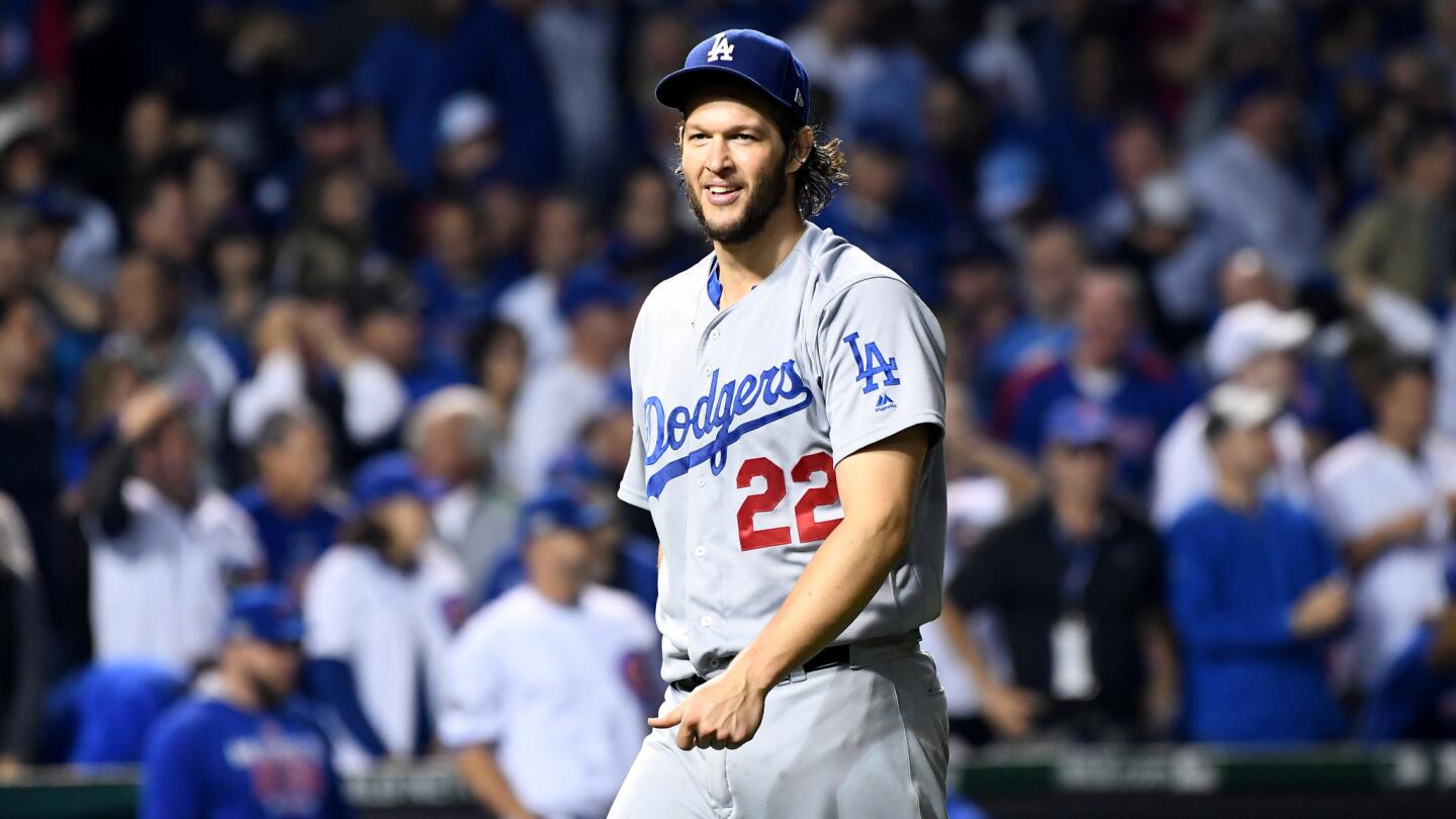 Dodgers left-hander Clayton Kershaw walks off the field in the seventh inning after recording the last out on a deep fly ball by Cubs second baseman Javier Baez on Sunday.