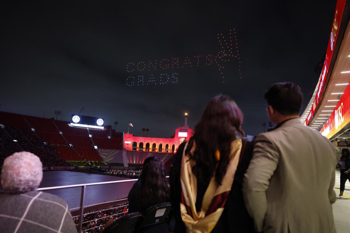 Families enjoy a drone show at the "Troy Family graduation party," at the Coliseum on May 9, 2024.