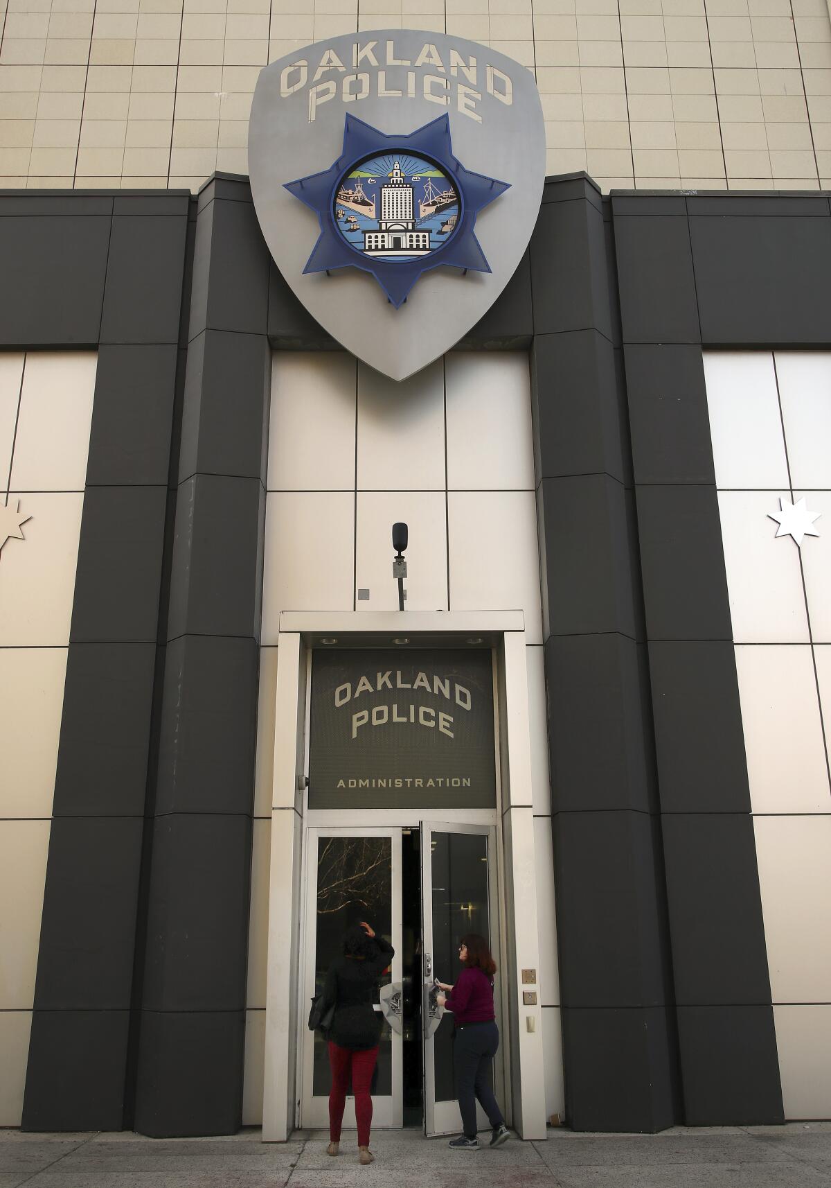 Women enter the Oakland Police Department in January 2018.