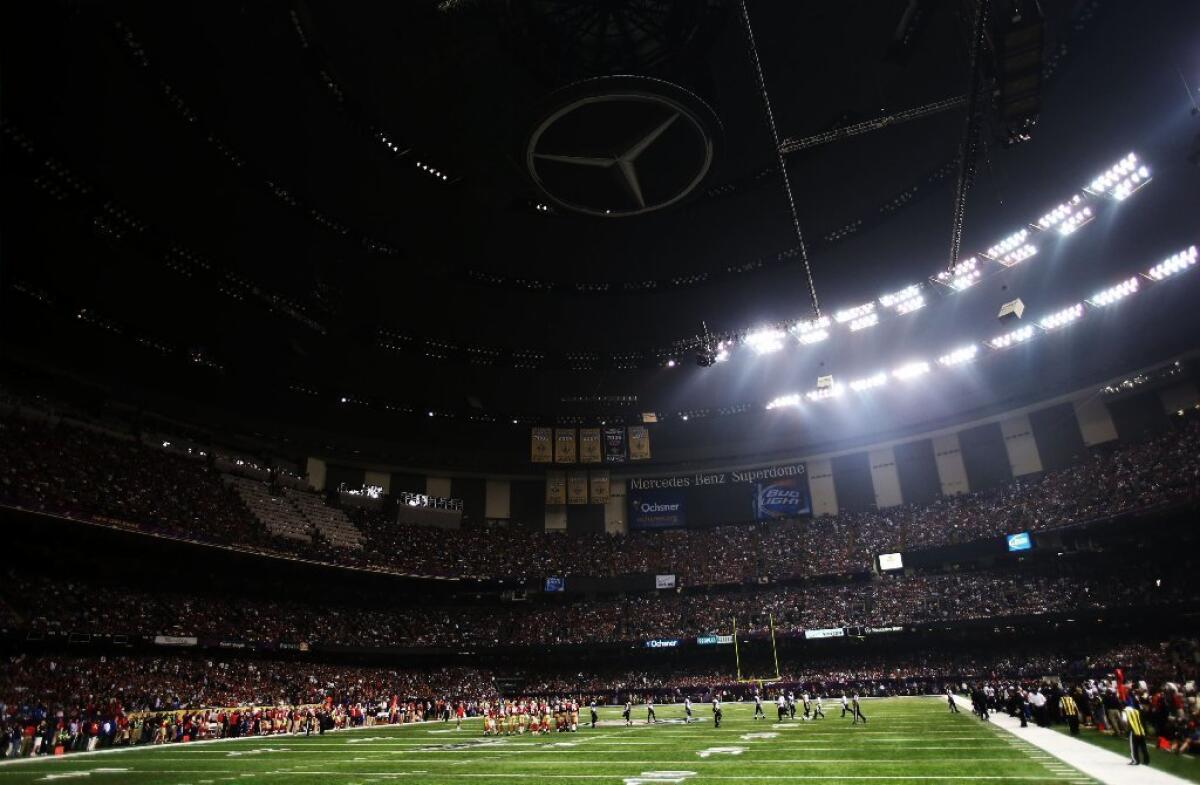Super Bowl play is stopped after power went out in half of the New Orleans Superdome.