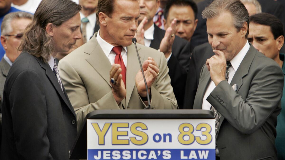 Former California Gov. Arnold Schwarzenegger appears at a 2006 Westwood news conference urging voters to support Jessica's Law, which limited where sex offenders could live. The governor was joined by Jessica's father, Mark Lunsford, left, and Marc Klass, father of kidnap victim Polly Klass.
