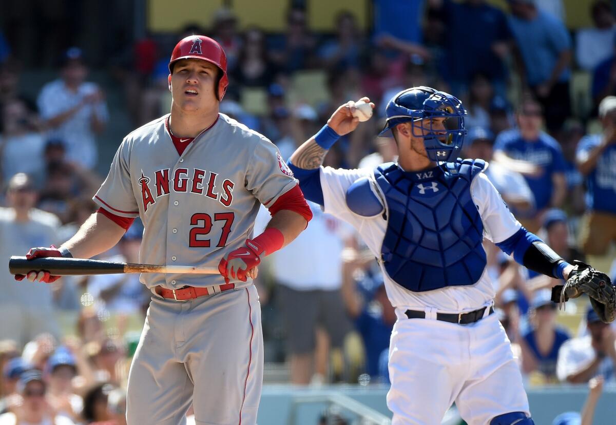 Angels outfielder Mike Trout heads back to the dugout after his strikeout against the Dodgers in the ninth inning.