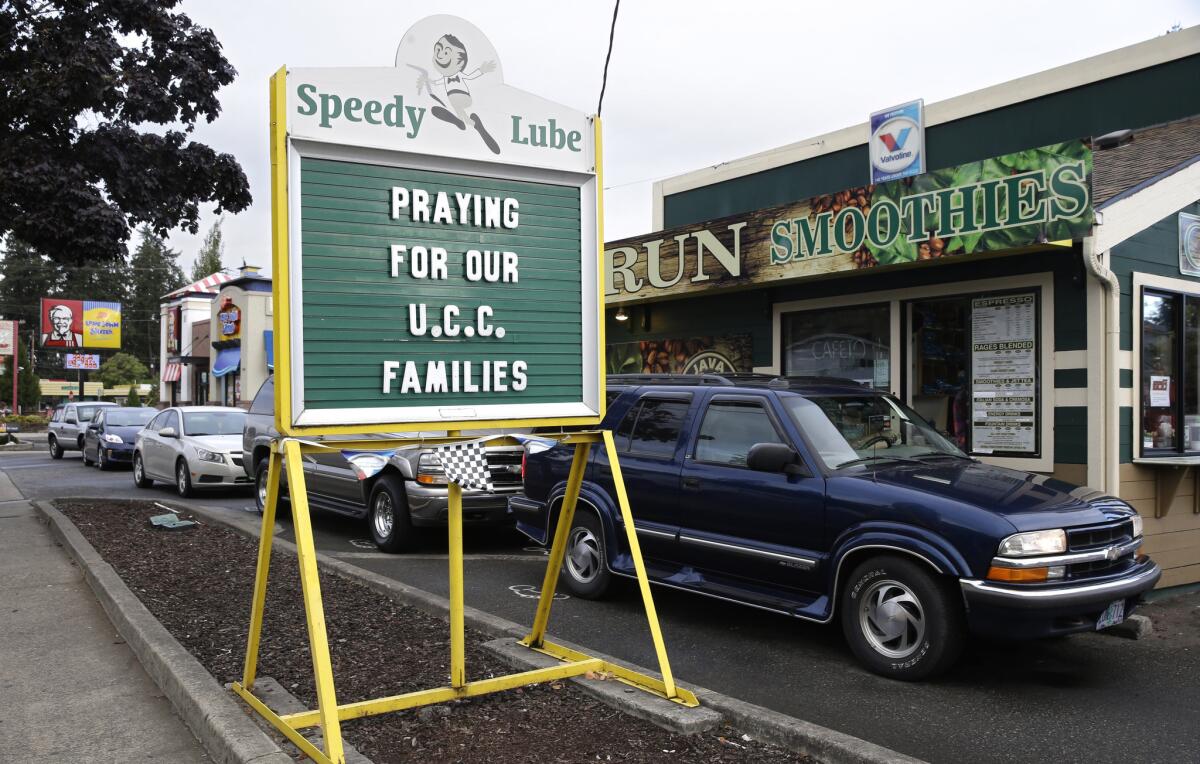 A message of healing is displayed at a local business after a fatal shooting at Umpqua Community College in Roseburg, Ore.