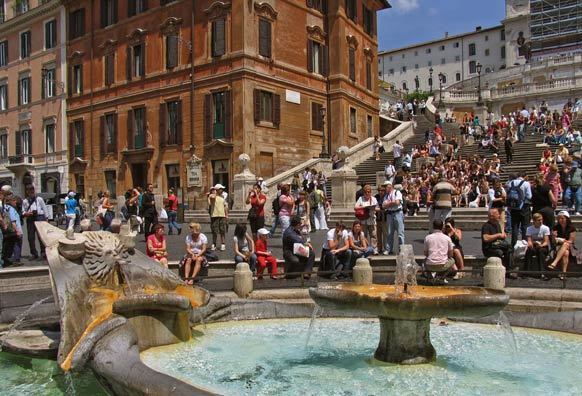 The Spanish Steps in Rome, built in the early 1700s, are a popular tourist resting spot. The 138 steps climb a steep slope.