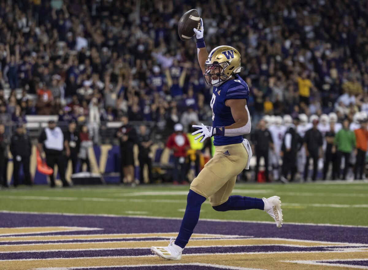 Washington running back Will Nixon celebrates after scoring a touchdown against Stanford.