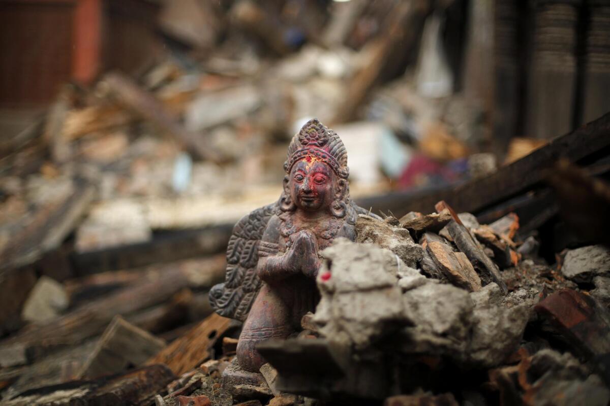 A religious statue in the rubble of a damaged temple at the Bhaktapur district in Nepal on April 27.
