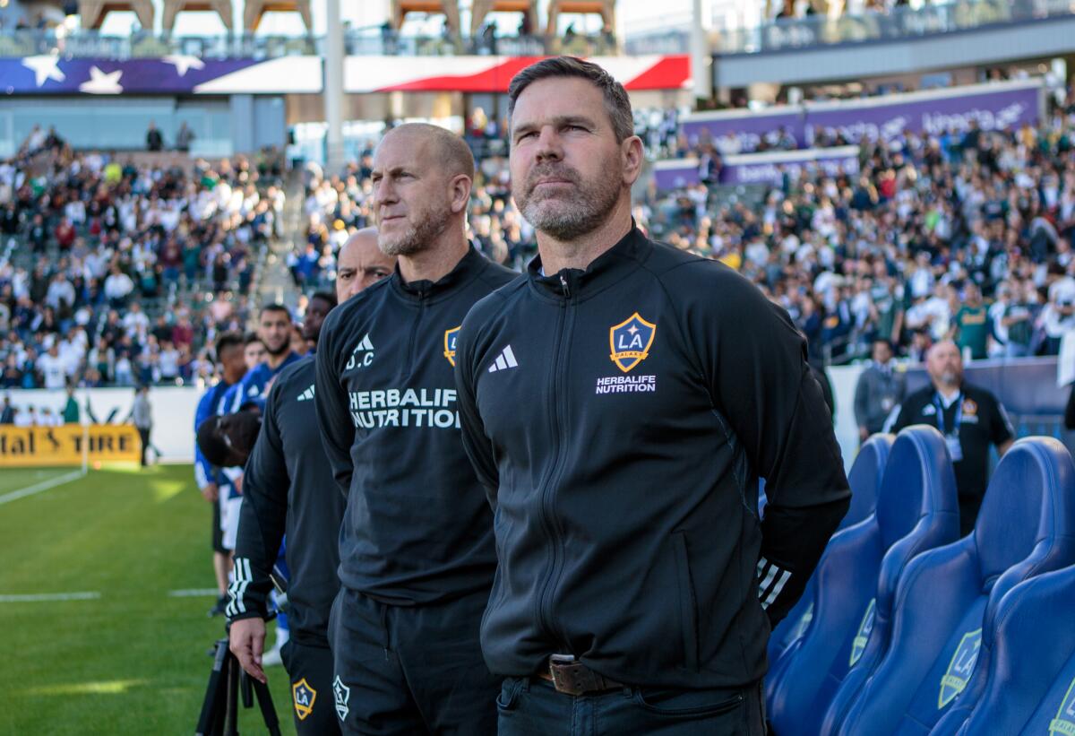 Galaxy coach Greg Vanney stands during the national anthem before a match against the Seattle Sounders.