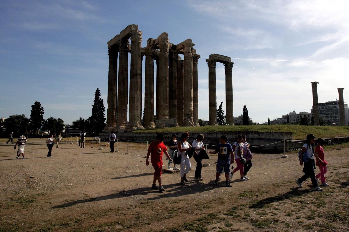 Tourists visit the Temple of Zeus in Athens, Greece, in this photo taken in 2009.