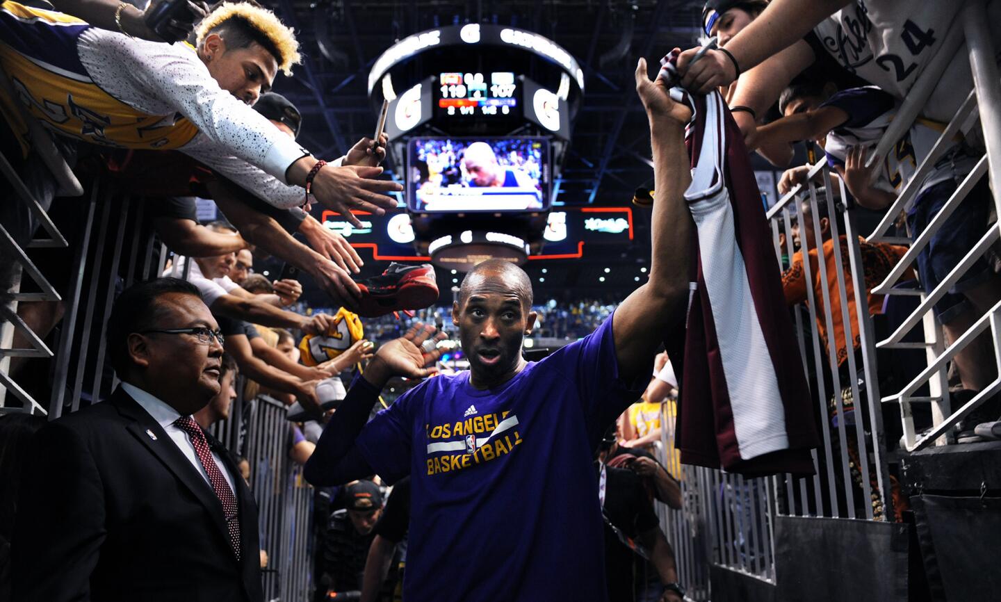 Lakers Kobe Bryant walks off the court for the last time after a game agianst the Suns in Phoenix on March 23.