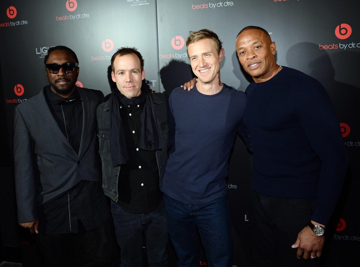 Recording artist will.i.am, Beats Electronics President Luke Wood, Beats Music CEO Ian Rogers and Beats Electronics Founder Dr. Dre arrive at a Beats by Dr. Dre Consumer Electronics Show after-party at the Light Nightclub at the Mandalay Bay Resort and Casino in Las Vegas.