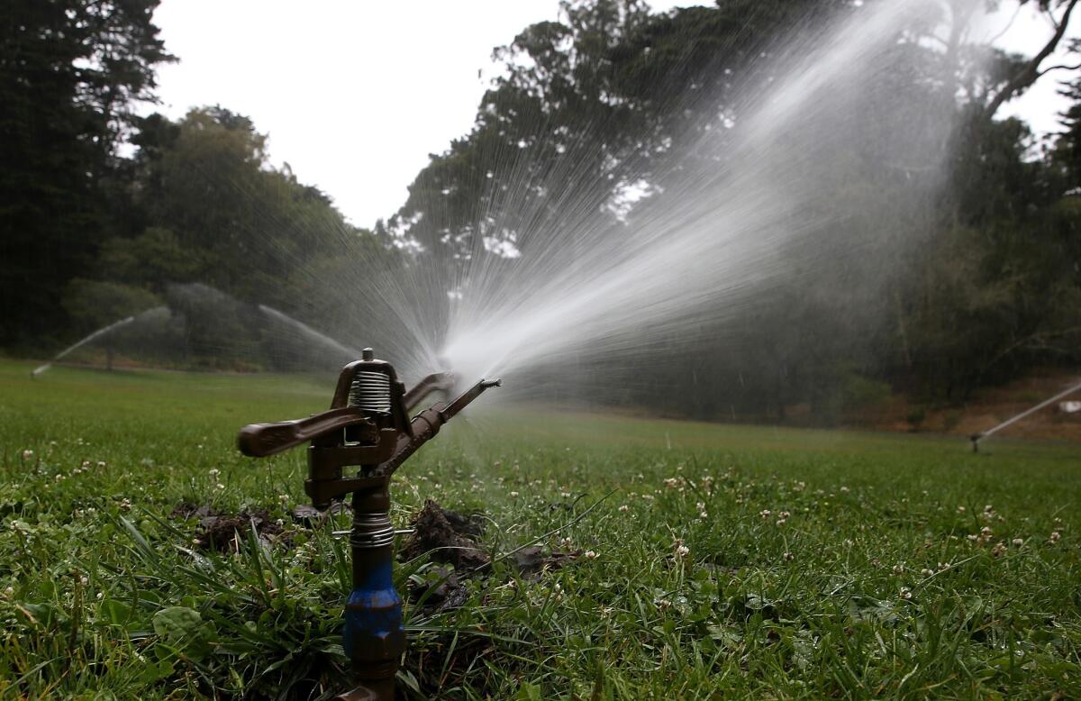 Sprinklers water a lawn in Golden Gate Park on July 15, 2014 in San Francisco, Calif. Following a public hearing Thursday, the Burbank City Council voted unanimously to enact stricter outdoor watering restrictions as part of the third phase of its water-conservation ordinance.