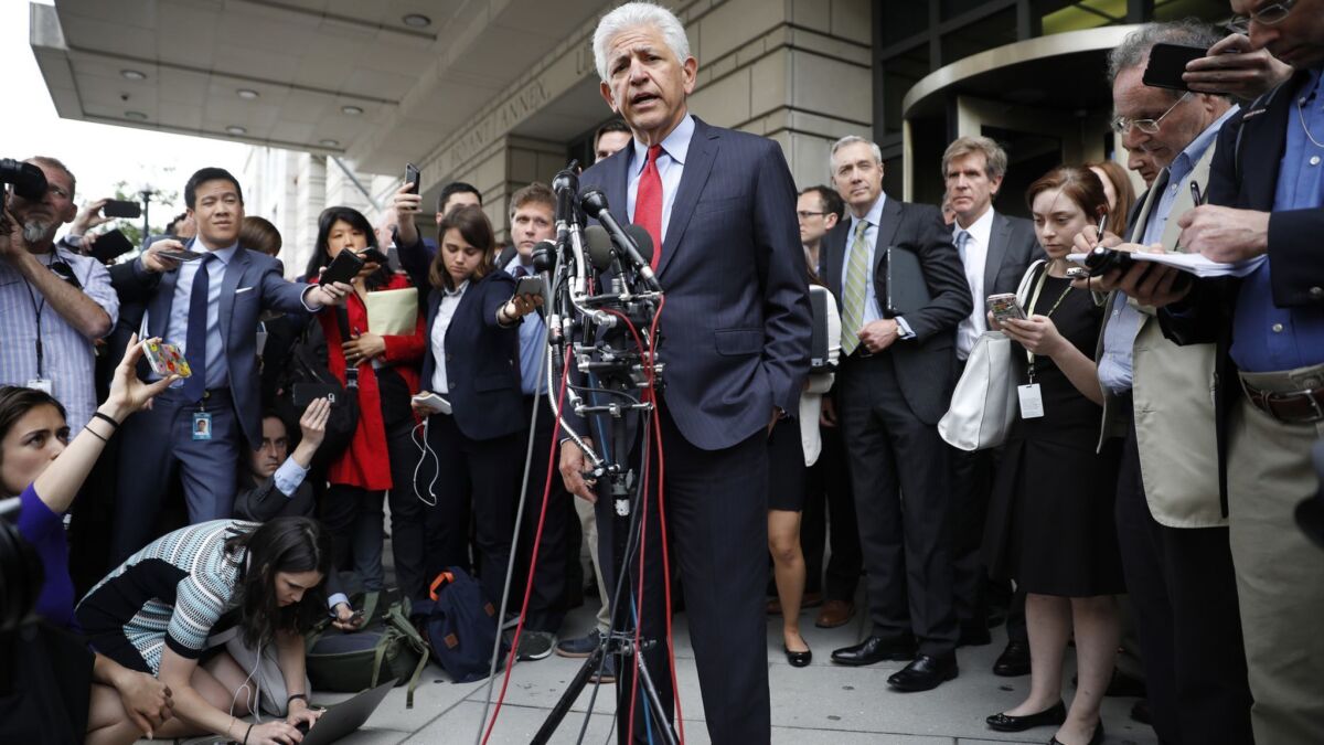 Daniel Petrocelli, the lead attorney for AT&T and Time Warner, addresses the media outside the courthouse in Washington on Tuesday following a judge's decision that will allow the two companies to merge.