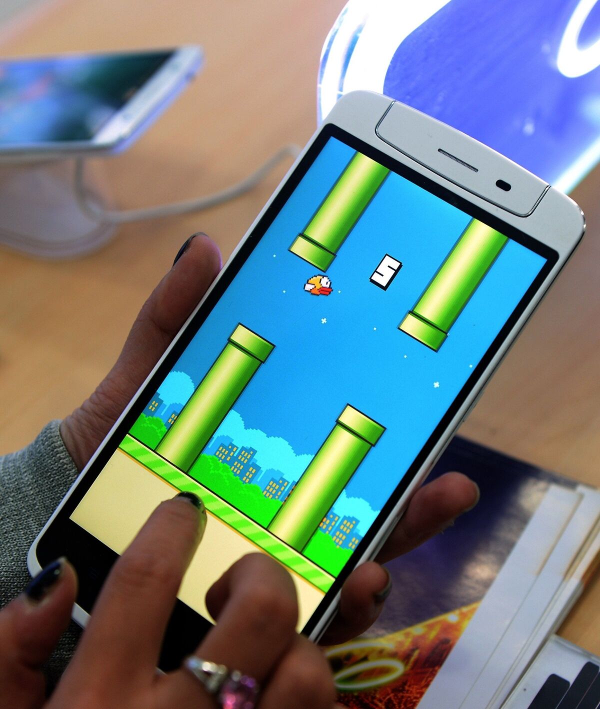 Since Flappy Bird, shown above, was removed from Google Play, fake versions of the game containing malware have sprung up around the Internet.