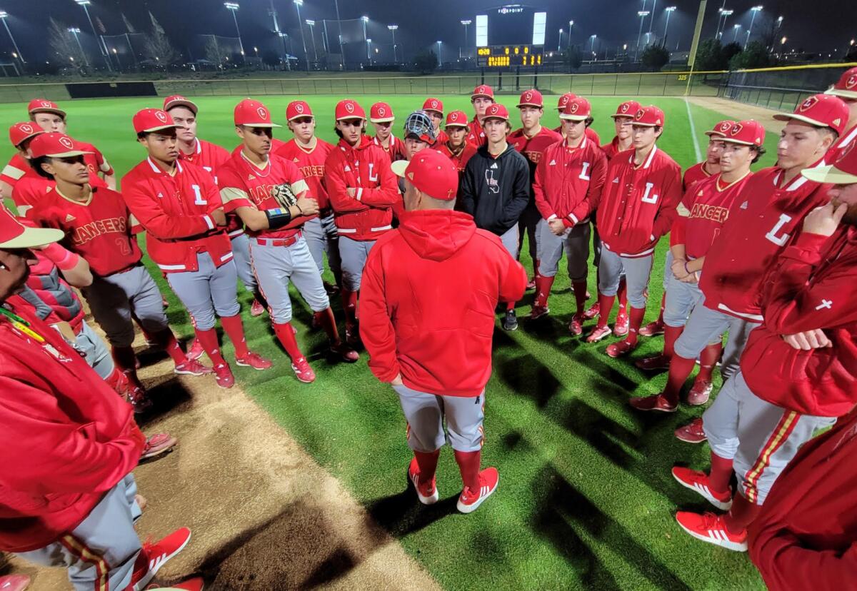 Orange Lutheran coach Eric Borba addresses his team.