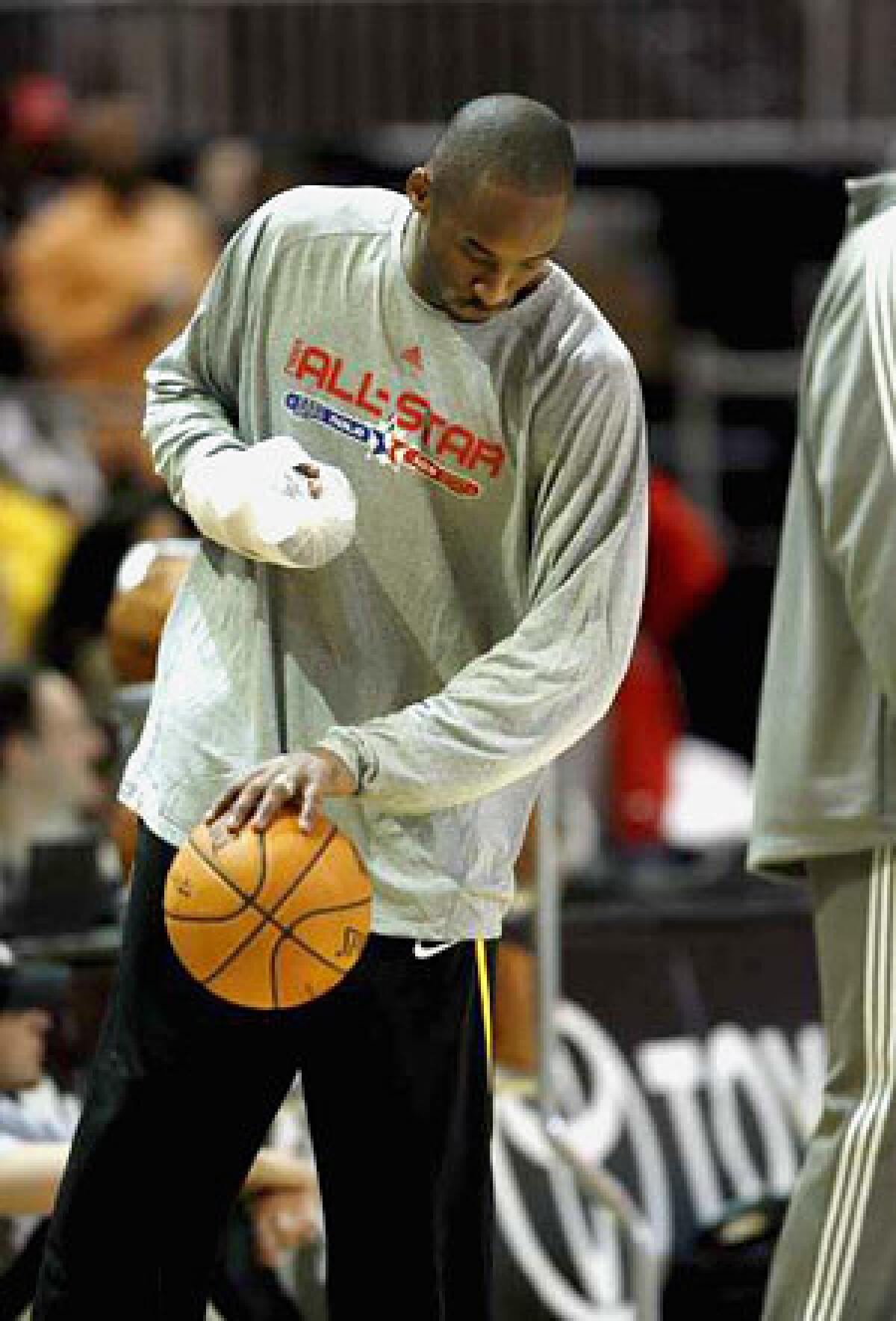 Kobe Bryant played just three minutes in the All-Star game, fulfilling his obligation to play and not miss any Lakers games. He has opted to forgo surgery on his injured right pinkie until after the season.