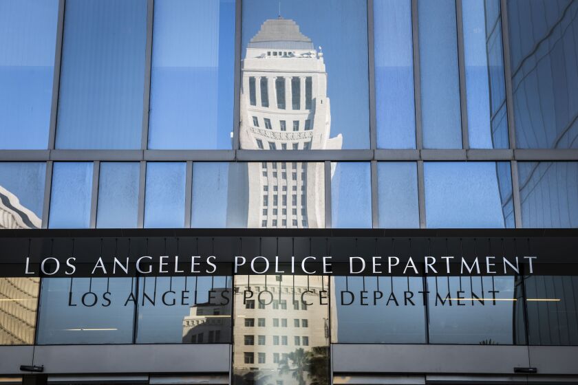 City Hall reflected on the Los Angeles Police Department headquarters in downtown Los Angeles on Friday, May 3, 2019. (Photo by Nick Agro / For The Times)