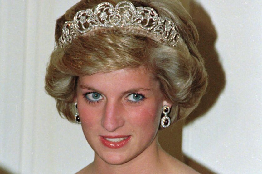 FILE - In this file photo dated Nov. 7, 1985, Britain's Princess Diana wears the Spencer tiara as she and Prince Charles attend state dinner at Government House in Adelaide, Austraila. The BBC’s board of directors has announced Wednesday Nov. 18, 2020, the appointment of a retired senior judge to lead an independent investigation into the circumstances around a controversial 1995 TV interview with Princess Diana. (AP Photo/Jim Bourdier, FILE)