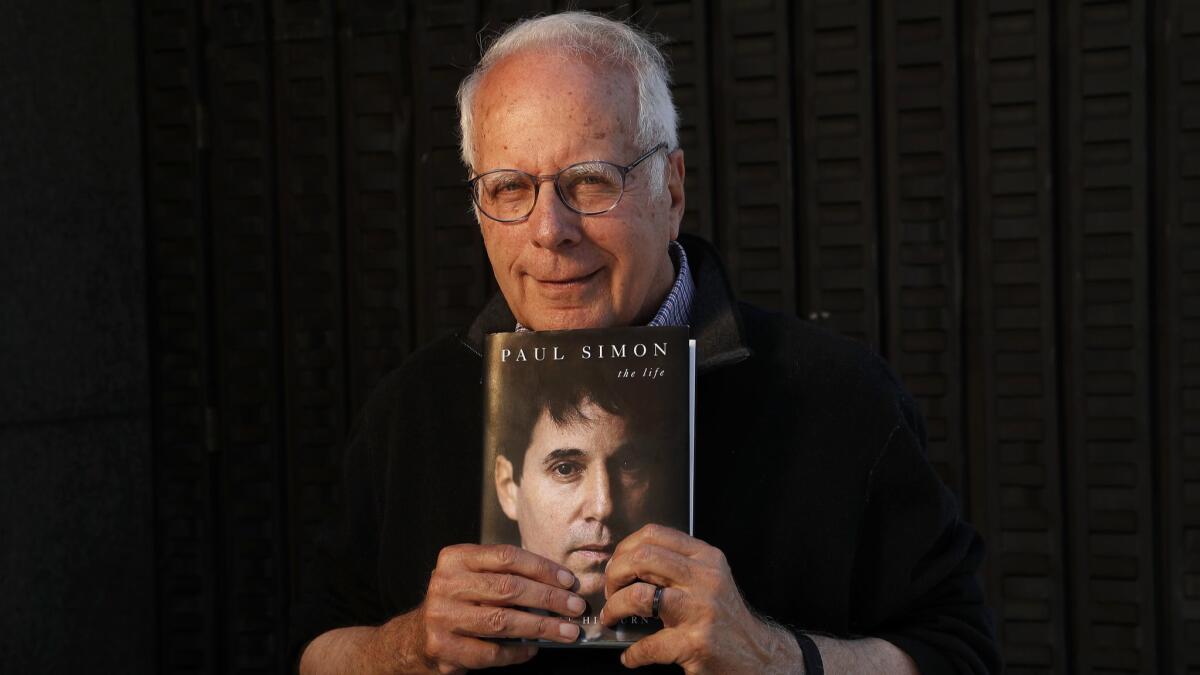 Author and former Times pop music critic Robert Hilburn with his new book, "Paul Simon: The Life."