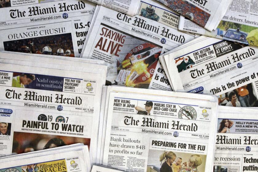 FILE - Copies of the McClatchy Co. owned Miami Herald newspaper are shown Oct. 14, 2009, in Miami. Hedge fund Chatham Asset Management plans to buy newspaper publisher McClatchy out of bankruptcy, ending 163 years of family control. The companies did not put a price on the deal in an announcement Sunday, July 12, 2020. The agreement still needs the approval of a bankruptcy judge; a hearing is scheduled for July 24. (AP Photo/Wilfredo Lee, File)