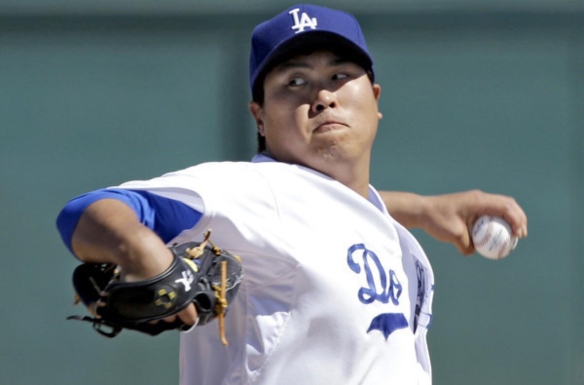 Dodgers starting pitcher Hyun-Jin Ryu delivers a pitch -- is it his wicked changeup? -- against the Colorado Rockies during an exhibition game last week.