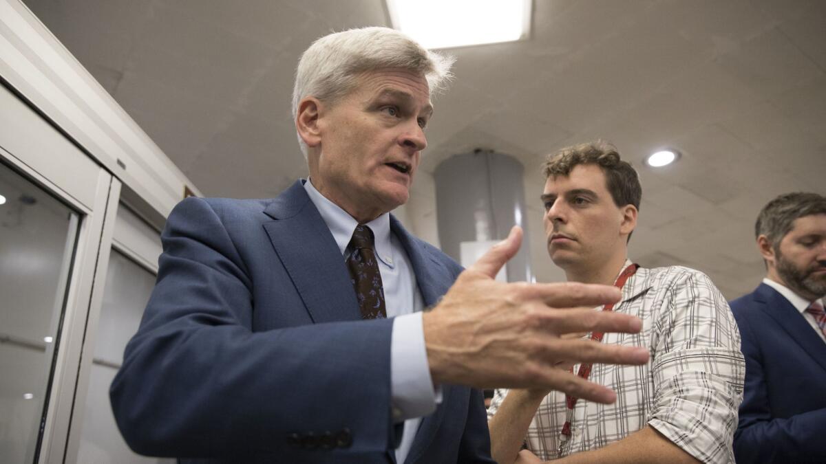 Sen. Bill Cassidy, R-La., tries to explain his Obamacare repeal bill on Wednesday. A revised version would be even worse for people with pre-existing conditions than Cassidy's original.