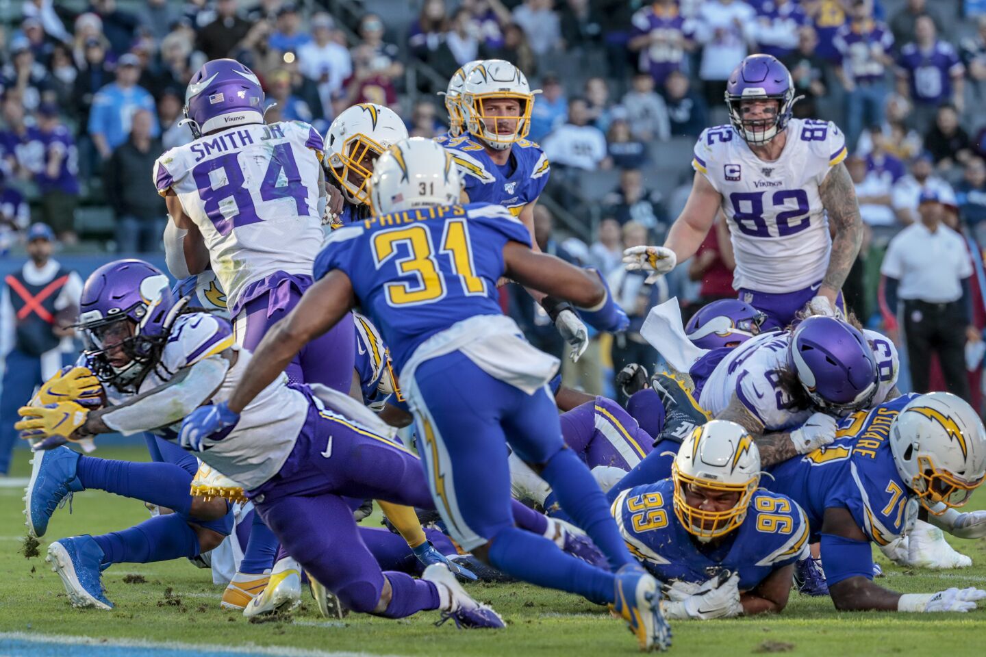 Minnesota Vikings running back Mike Boone dives into the end zone for a two-yard touchdown late in the game.