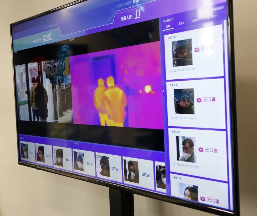 A thermal imaging system controls the body temperatures of people entering the Capital Indoor Stadium in Beijing.