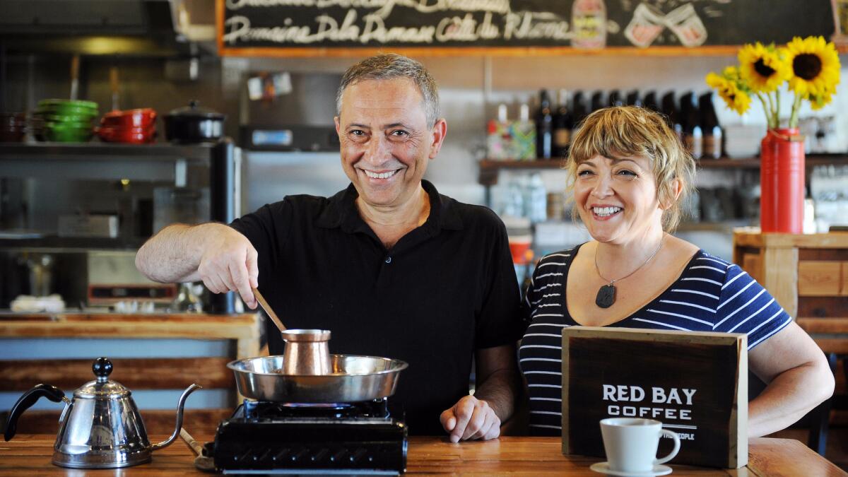 Stan Mayzalis and Angie Corrente make Jazzve style coffee at Doma Kitchen in Manhattan Beach.