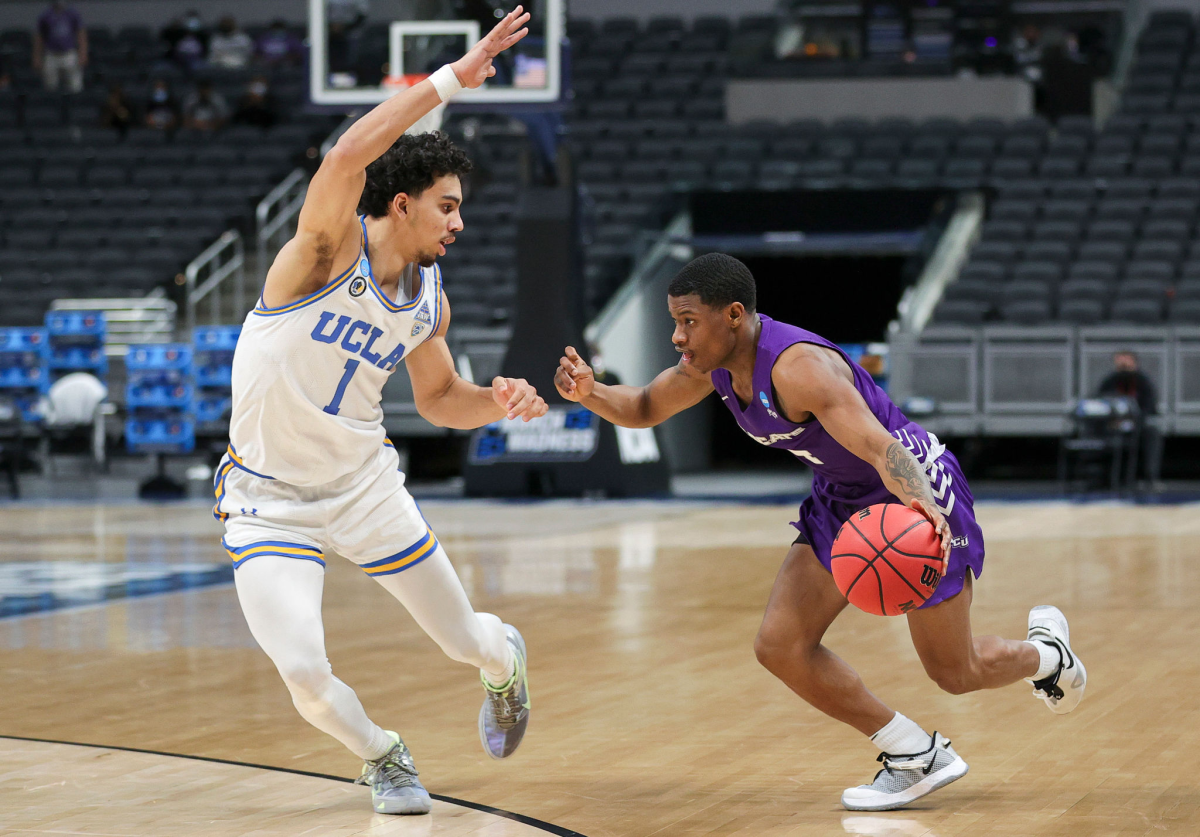 UCLA's Jules Bernard, left, defends against Abilene Christian's Damien Daniels.