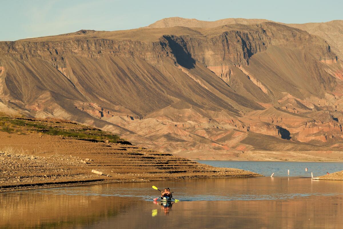 Kayakers in a very low lake